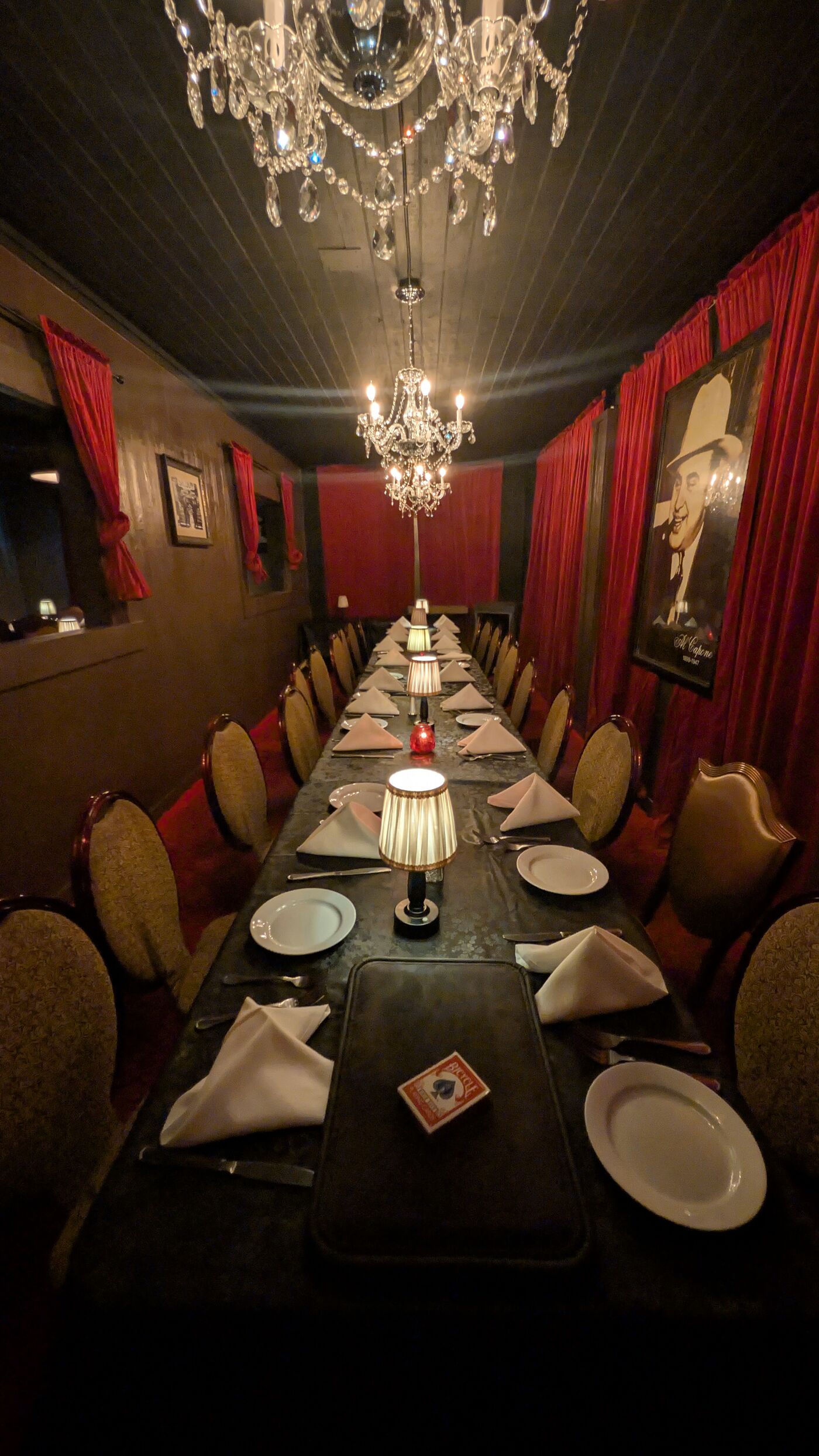 A candlelit dining room set for a private event
