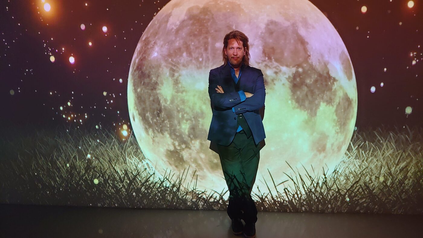 V photographed against a full moon